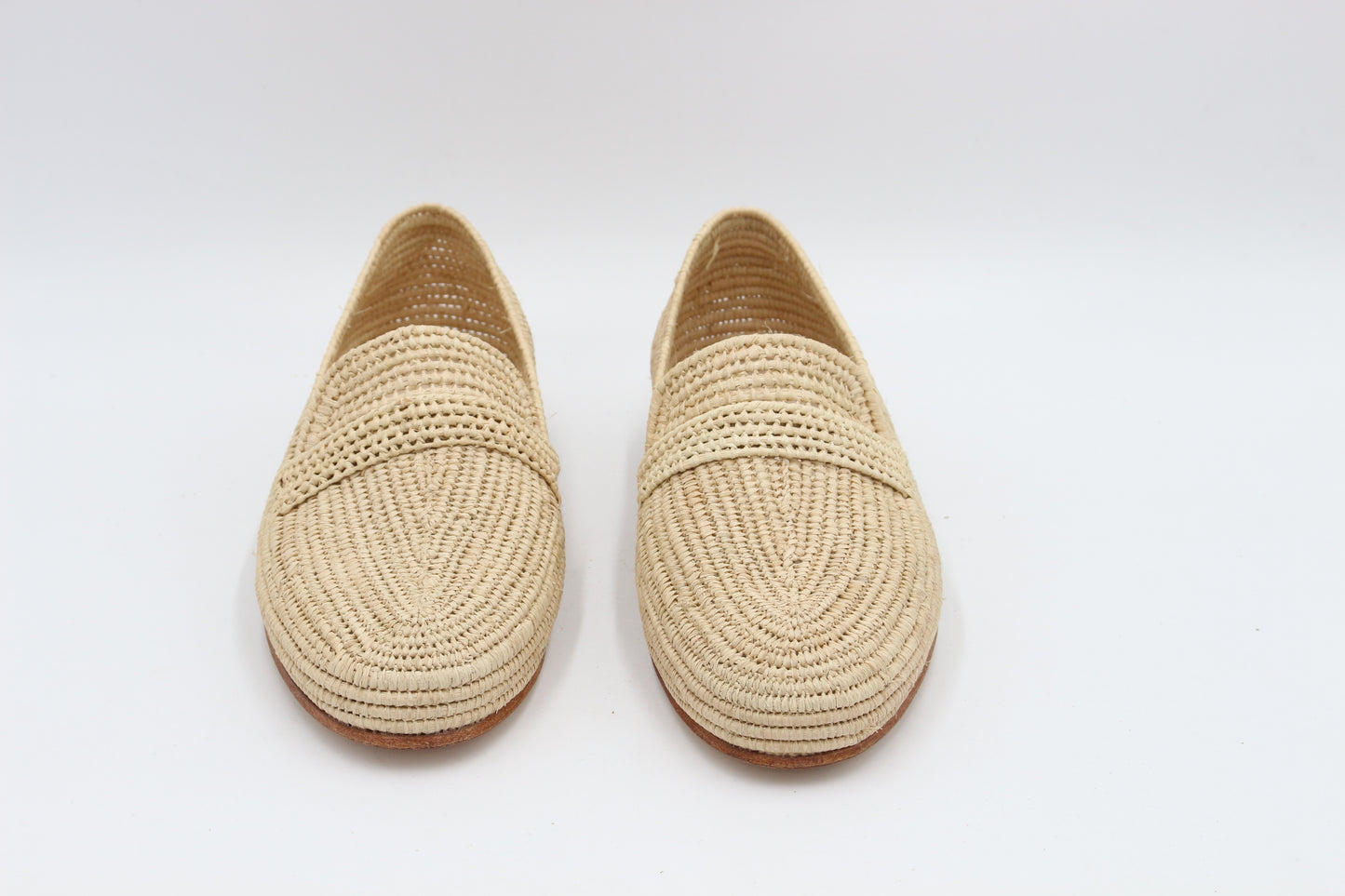 Pair of woven shoes on a white background