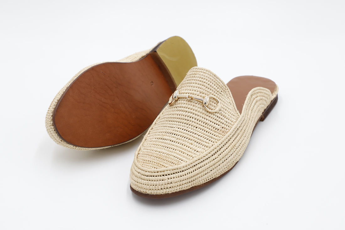 Beige woven slipper with brown insole on a white background
