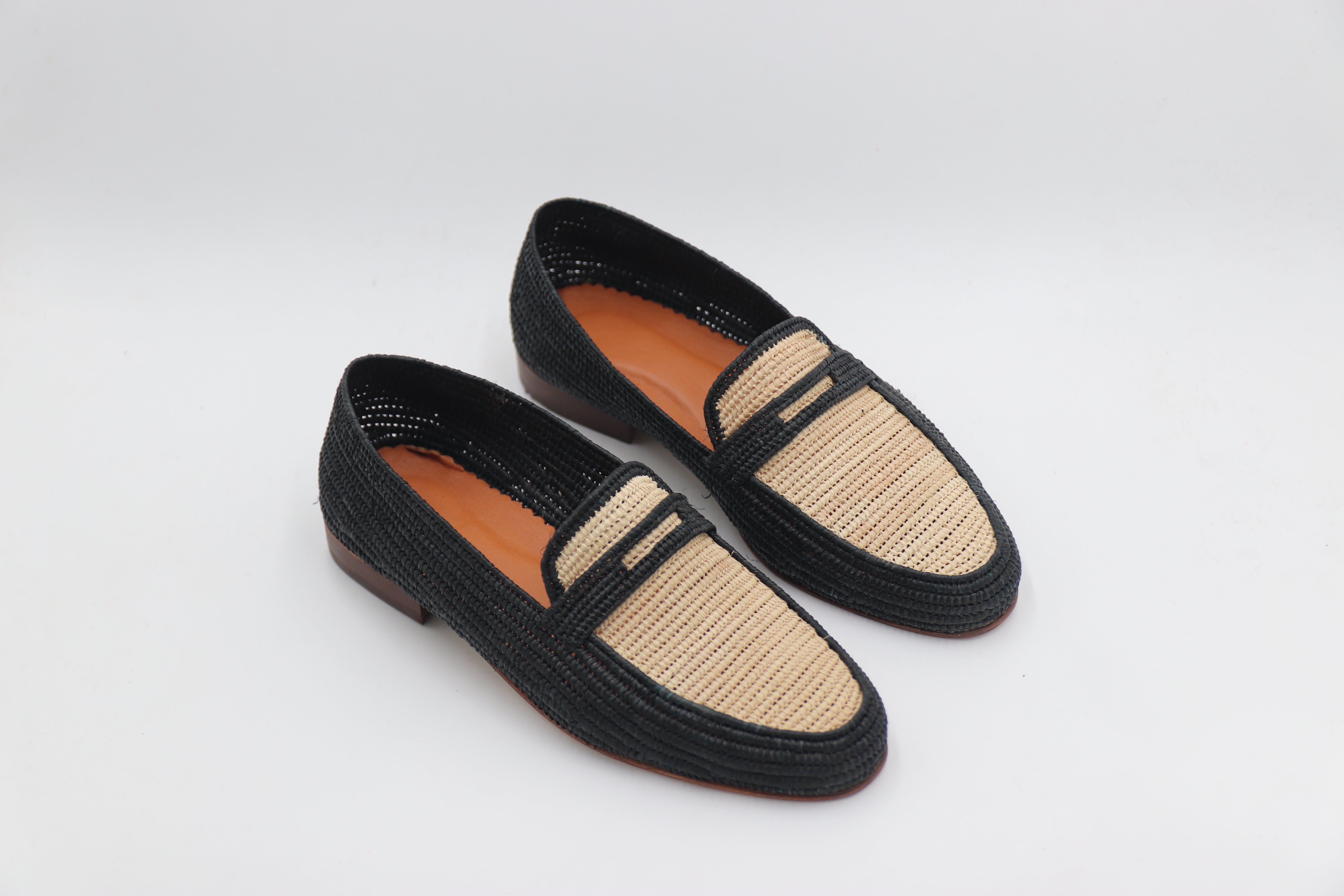 Detail shot of handwoven raffia Oxford shoe broguing pattern