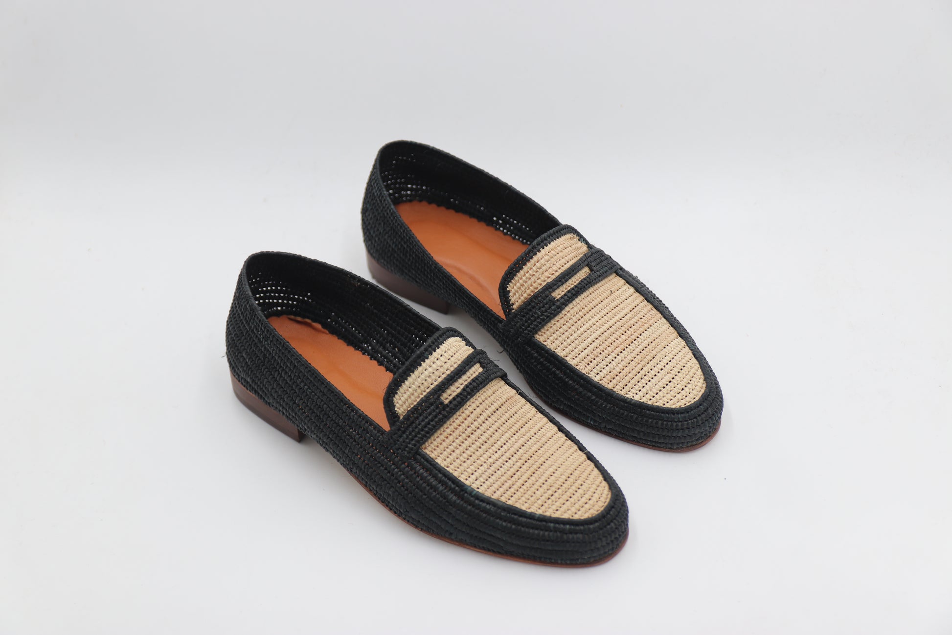 Detail shot of handwoven raffia Oxford shoe broguing pattern