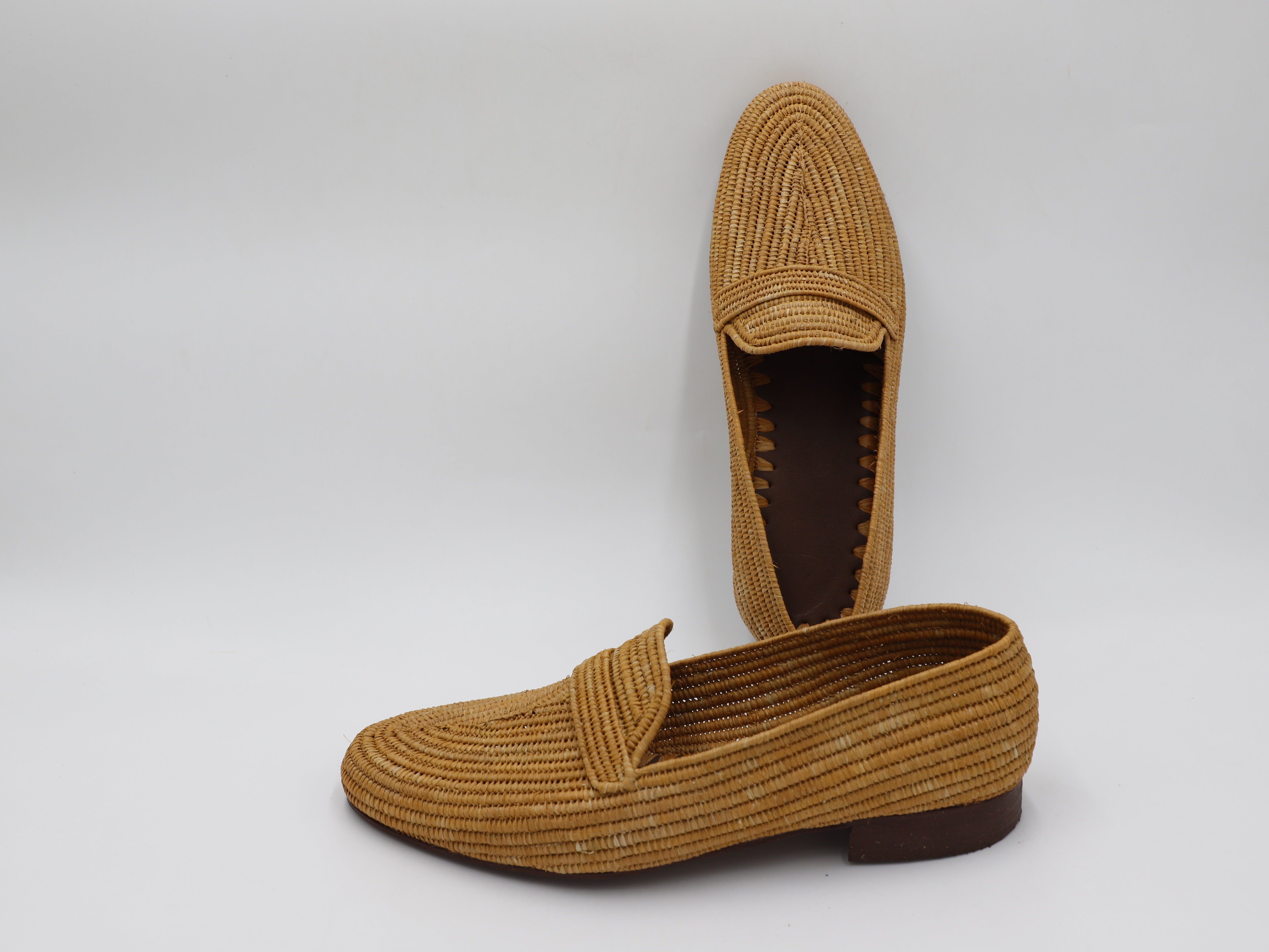 Close-up of men’s handmade raffia shoes showing woven detail
