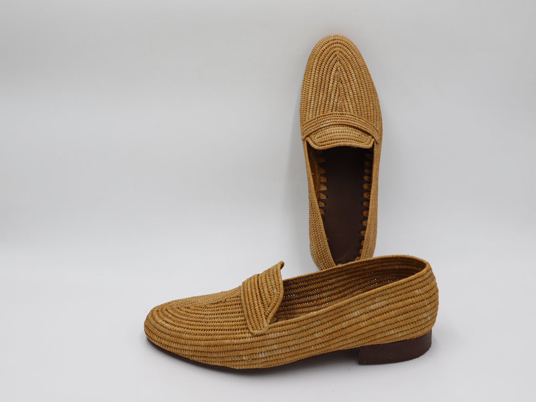 Close-up of men’s handmade raffia shoes showing woven detail
