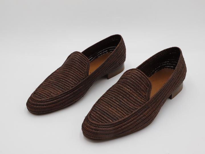 Men's raffia shoes on sandy beach – perfect summer footwear

